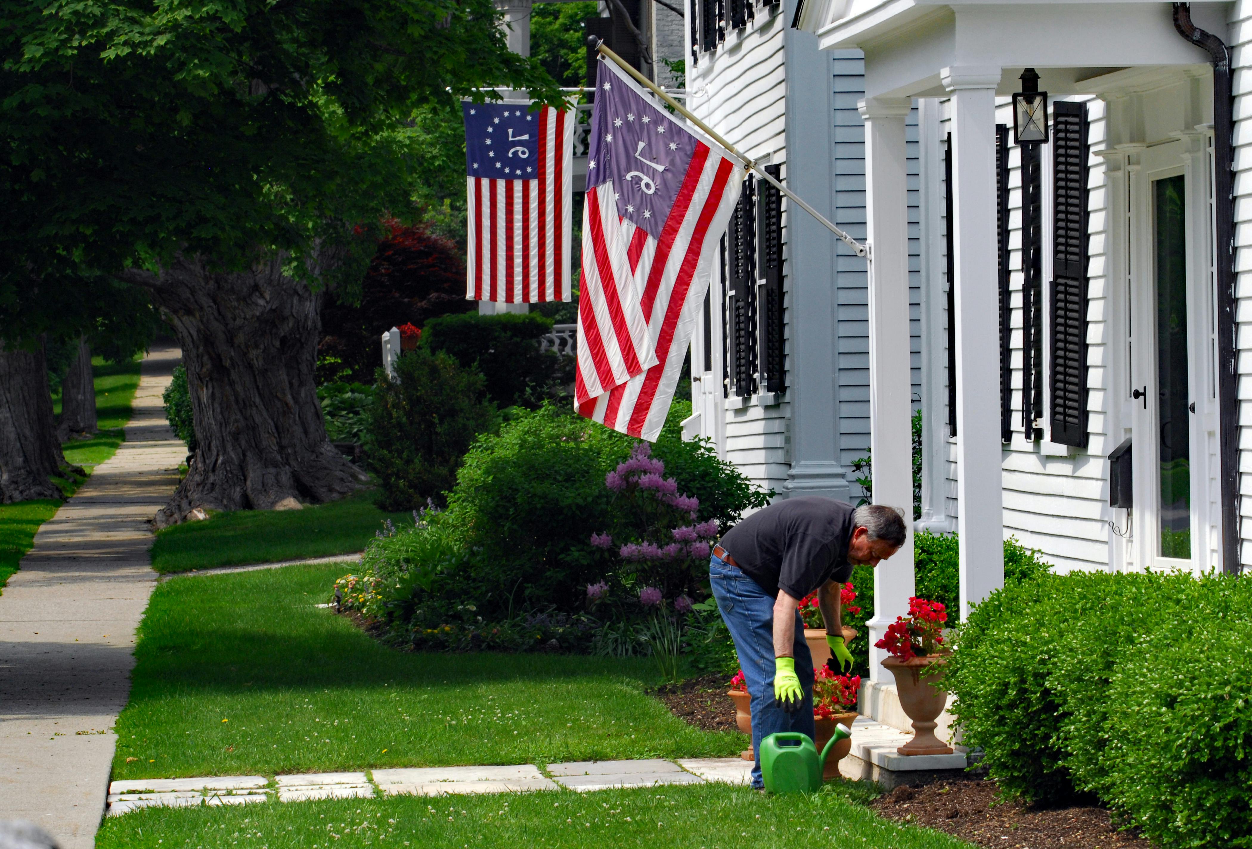 homeowner performing basic AC maintenance - ac compressor repair cost
