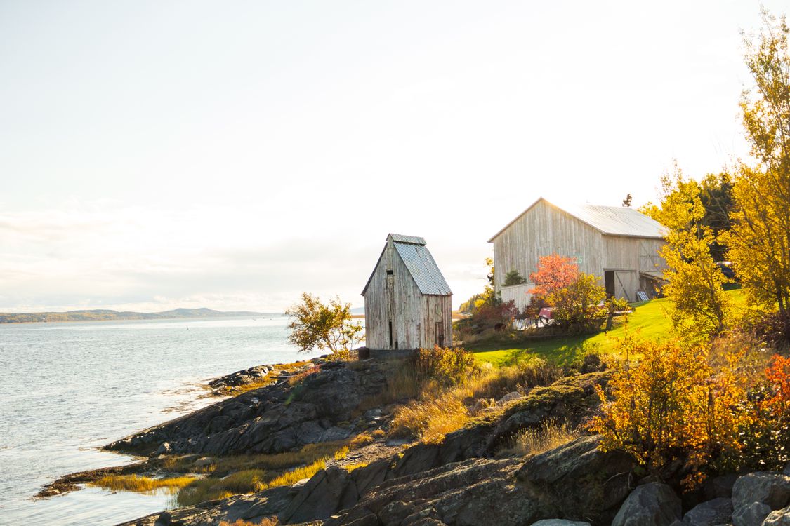 Rustic Quebec Charming Autumn Scene of Québec Coastline with Barns · Free Stock Photo