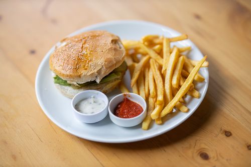 Free Delicious burger with crispy french fries served with ketchup and mayonnaise. Stock Photo