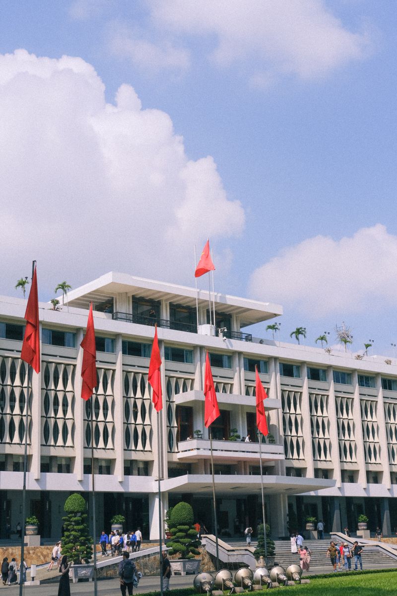 Reunification Palace in Ho Chi Minh City with red flags