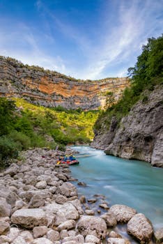 Explore the stunning Verdon Gorge with clear turquoise water and cliffs in Provence, France.