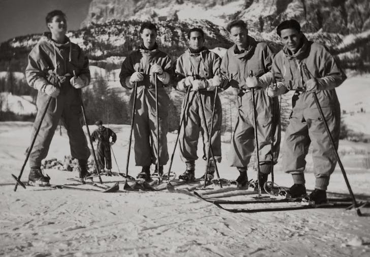Grayscale Photo of Men in Ski Blades