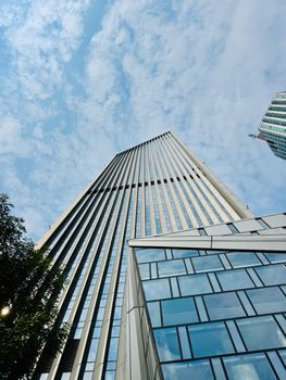 Majestic skyscraper view in Tianjin, capturing architectural elegance under a clear blue sky.