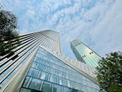 Modern skyscrapers reaching towards a blue sky