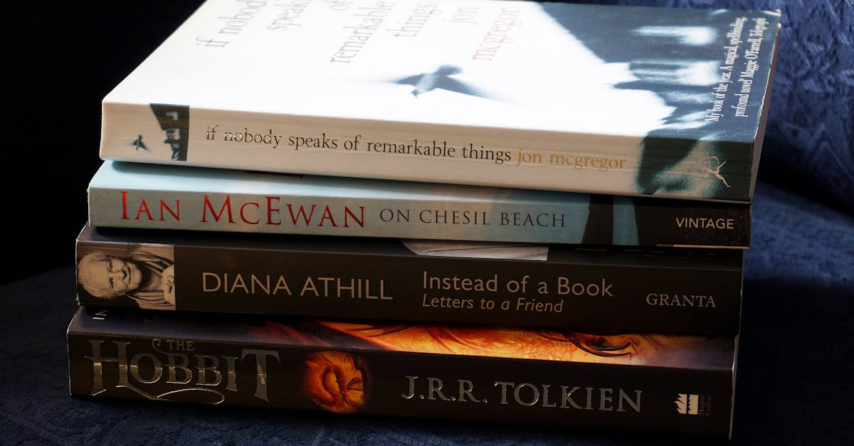 A stack of classic novels including works by McEwan, Athill, McGregor, and Tolkien.