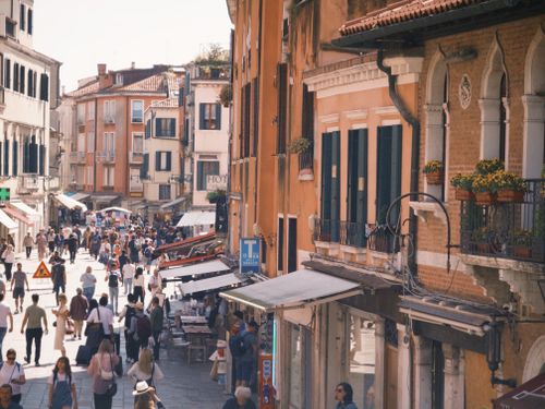 Free A busy street in Venice, Italy with historic architecture on a sunny day. Stock Photo