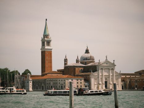 Captivating view of San Giorgio Maggiore in Venice with boats and historic architecture.