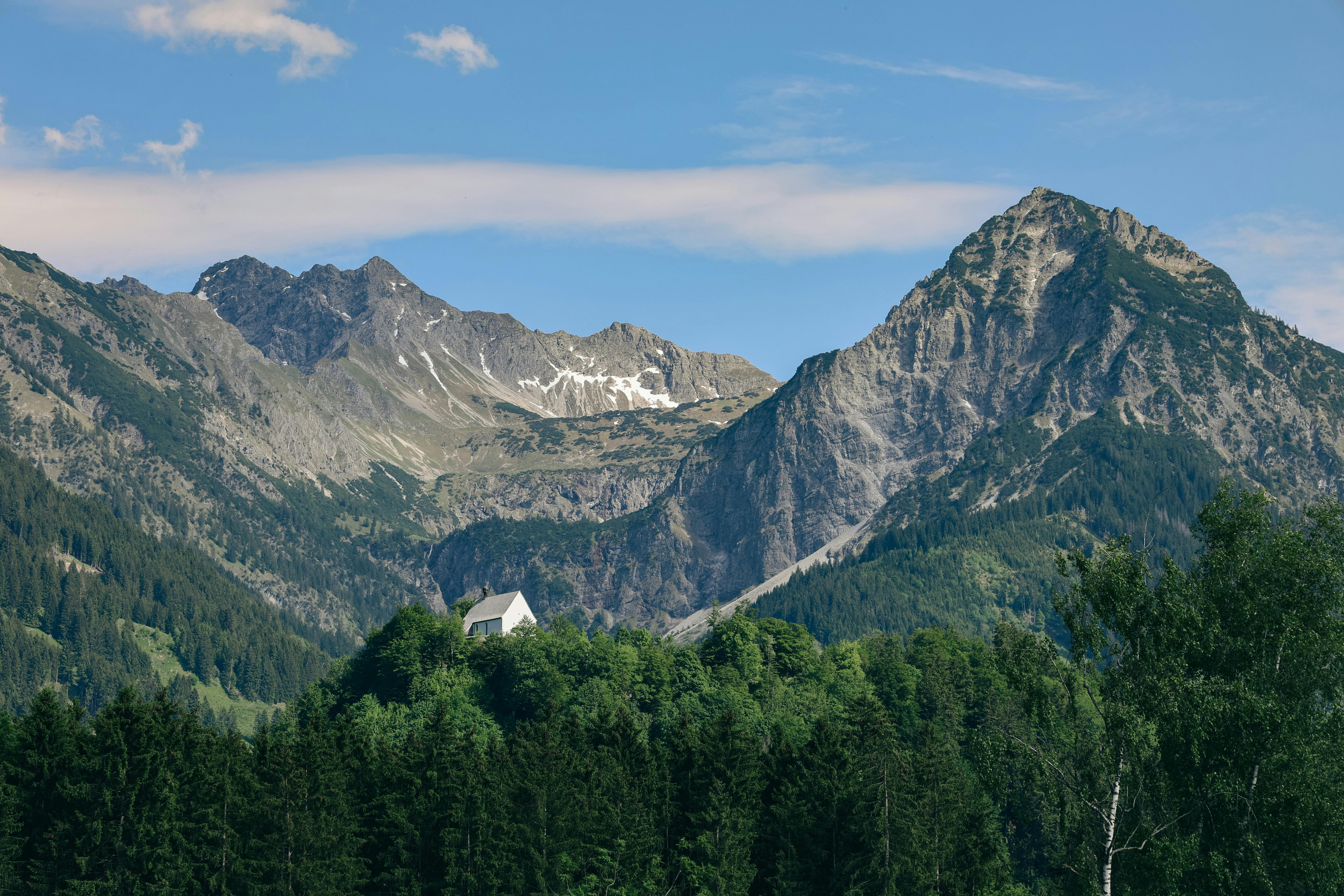 Beautiful summer view of mountains and forests in Fischen im Allgäu, Germany.