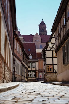 Explore the cobblestone streets and historic architecture of Quedlinburg, Germany.