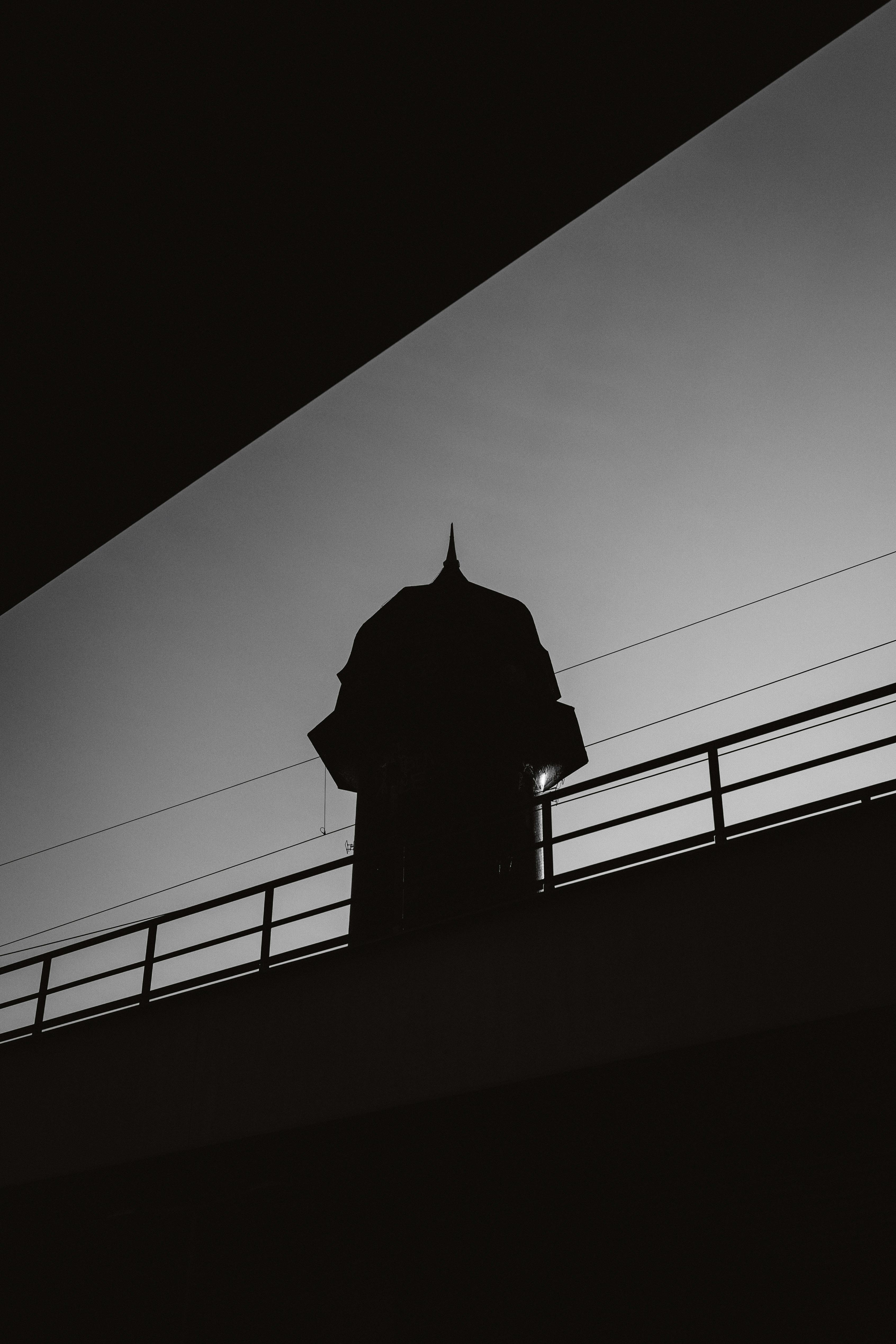 Free Black and white silhouette of a tower with dramatic sky in Berlin, Germany. Stock Photo