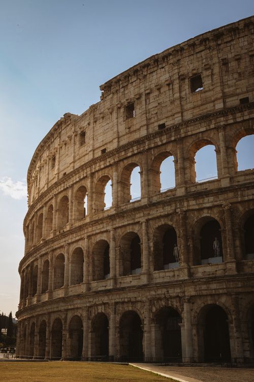 Free Historic Roman Colosseum captured with dramatic lighting in Rome, Lazio, Italy. Stock Photo