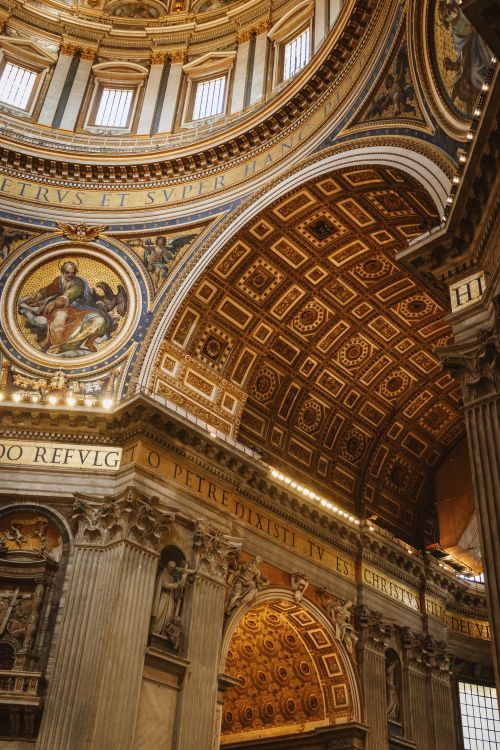 Free Stunning architectural detail of St. Peter's Basilica, showcasing intricate mosaics and grand columns. Stock Photo