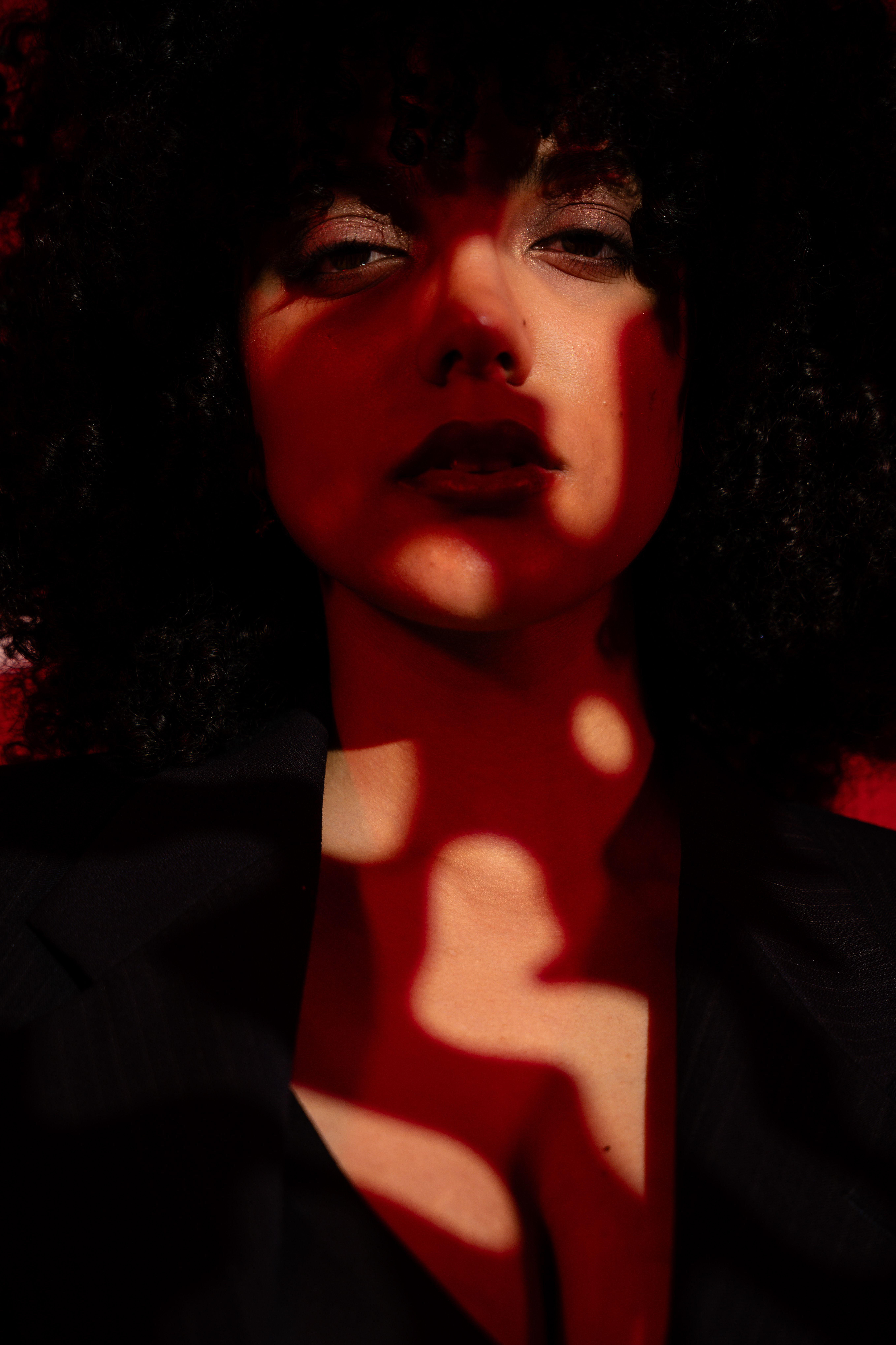 Ethereal Portrait in Dramatic Red Shadows · Free Stock Photo