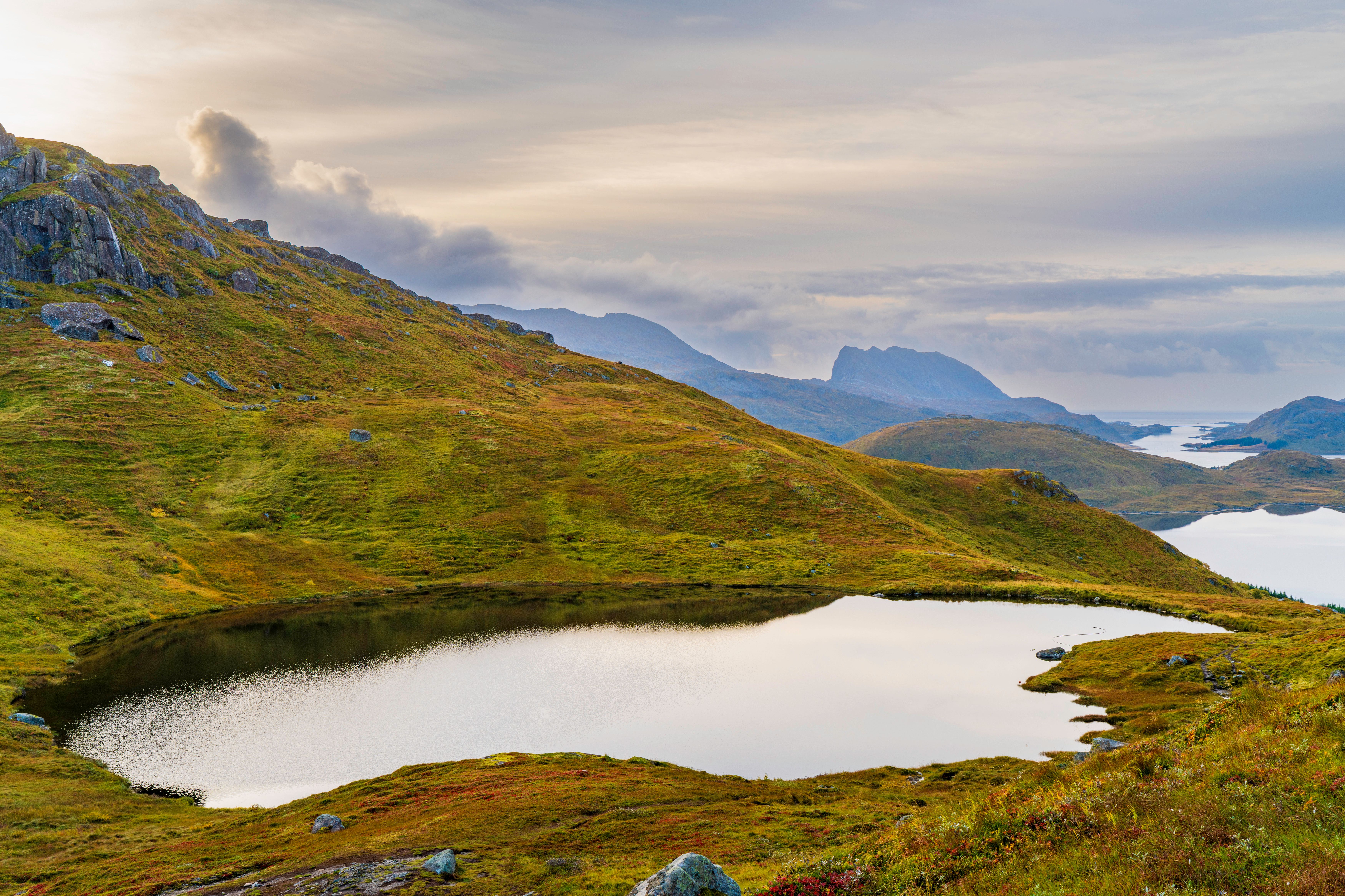 Best Northern Lights Hunt with The Green Adventure - Photos Included Review: The Ultimate Aurora Chase in Norway Review 2026 - Peaceful mountain scene with a tranquil lake in Nordland, Norway.