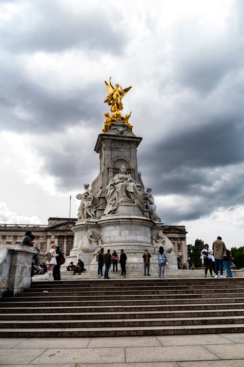 Free Dramatic view of Victoria Memorial in London with golden statues under cloudy skies. Stock Photo
