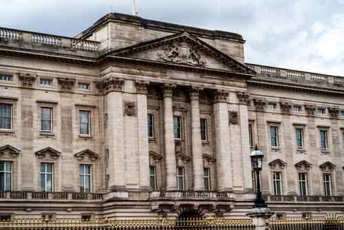 Free Historic architecture of Buckingham Palace in London on a cloudy day. Stock Photo