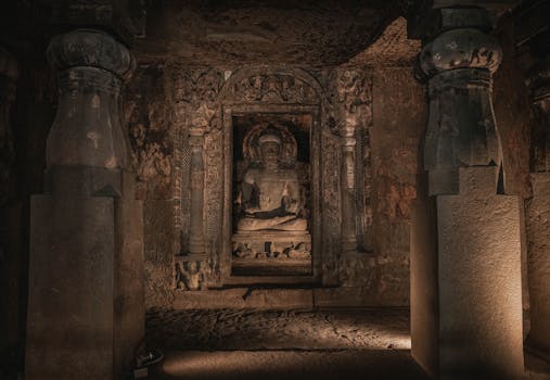 Intricate Buddha sculpture inside the historic Ajanta Caves in Maharashtra, India.