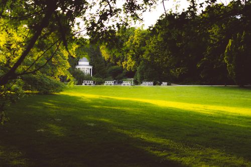 Free Peaceful garden scene in a park with lush greenery and historic pavilion in Calden, Germany. Stock Photo