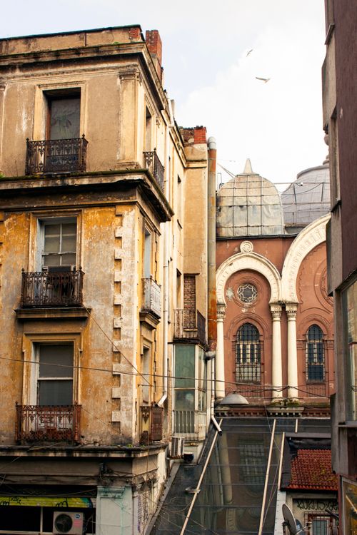 Free A view of historic buildings with a prominent dome, showcasing urban architecture. Stock Photo