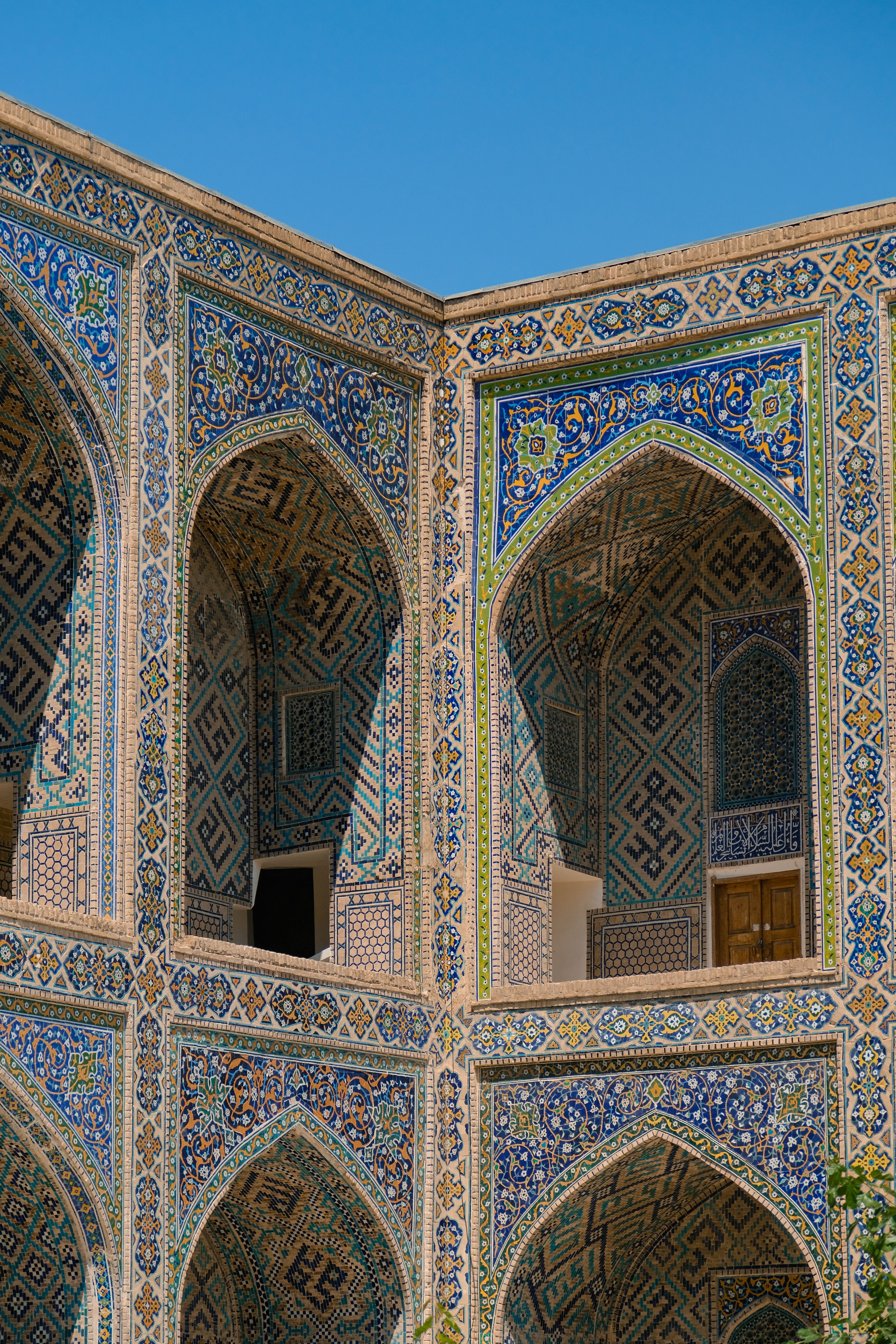 Close-up of traditional Islamic mosque architecture with vibrant blue mosaics