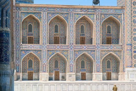 Beautiful intricate tile designs on a historic Islamic madrasa building showcasing traditional architecture.