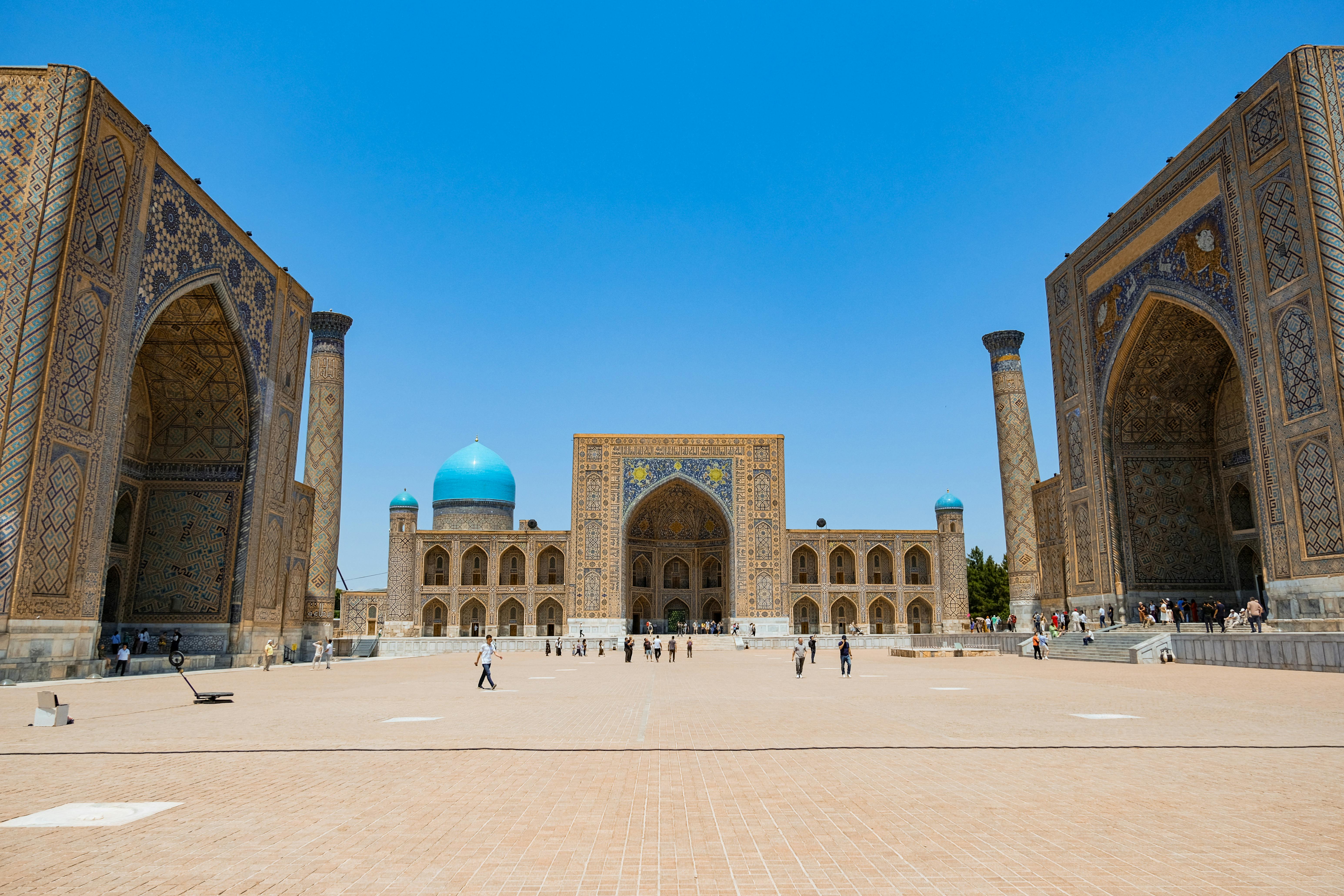 Spectacular daytime view of Registan Square, Samarkand with vibrant architecture.