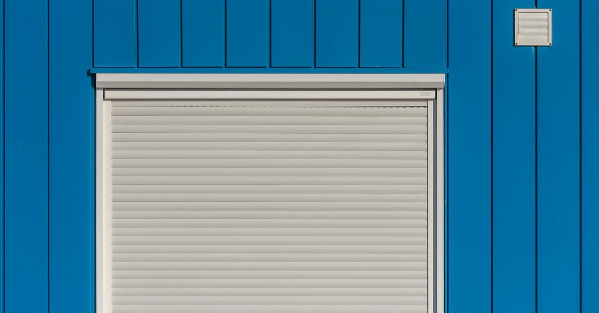 Shutter In Building Minimalist Blue Building With Roller Shutter · Free Stock Photo