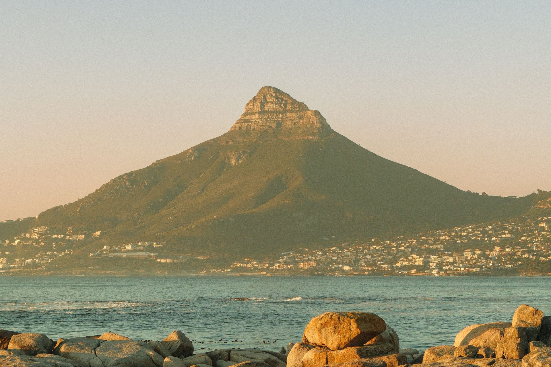 Lion's Head view from rocky beach at sunset in Cape Town