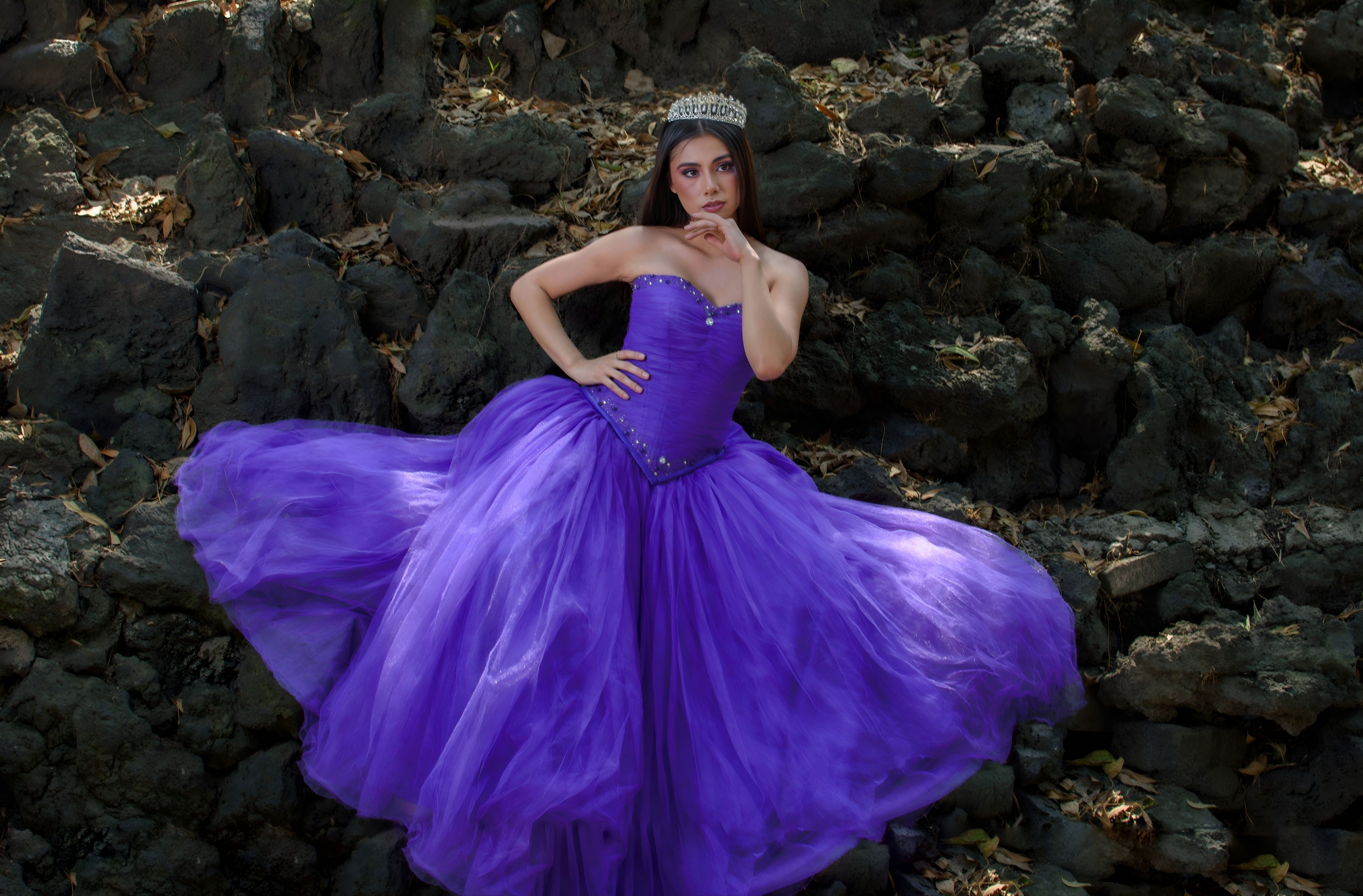 Elegant Young Woman in a Purple Gown Outdoors · Free Stock Photo