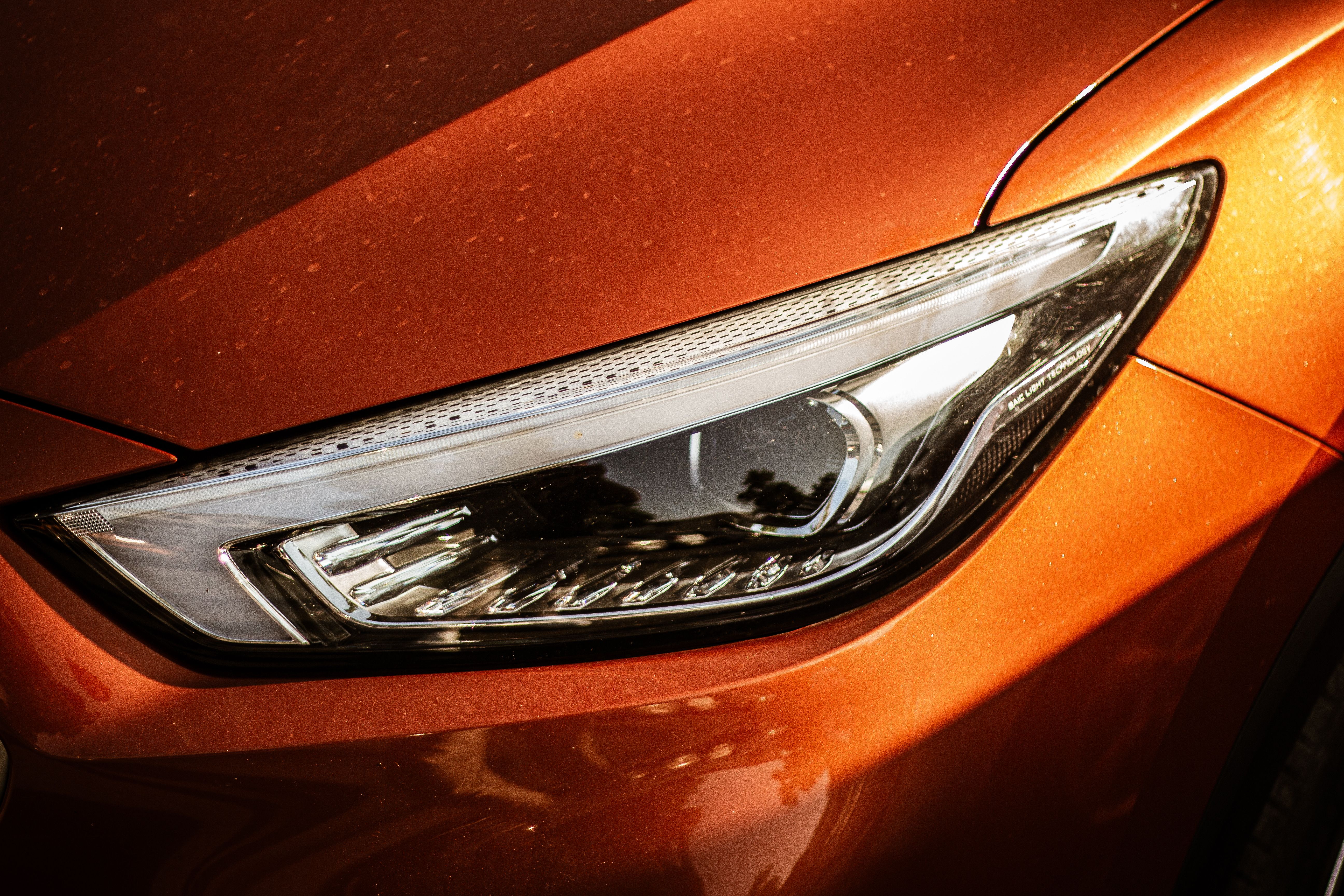Modern Car Headlight in Close-up View · Free Stock Photo
