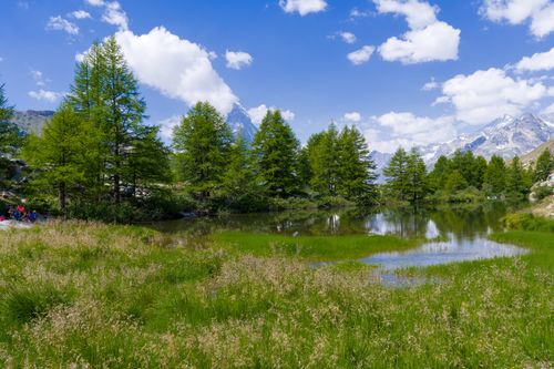 Free Beautiful alpine landscape with clear sky, serene lake, and Swiss Alps in Zermatt. Stock Photo
