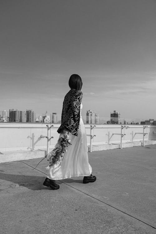 Free Greyscale Photography of Woman Walking Stock Photo