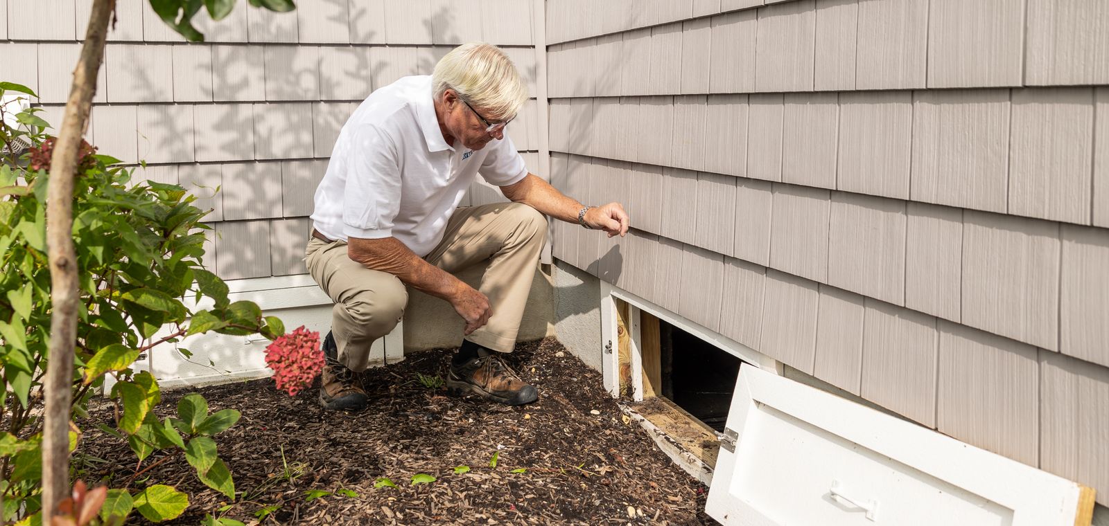 Inspecting a crawl space entrance