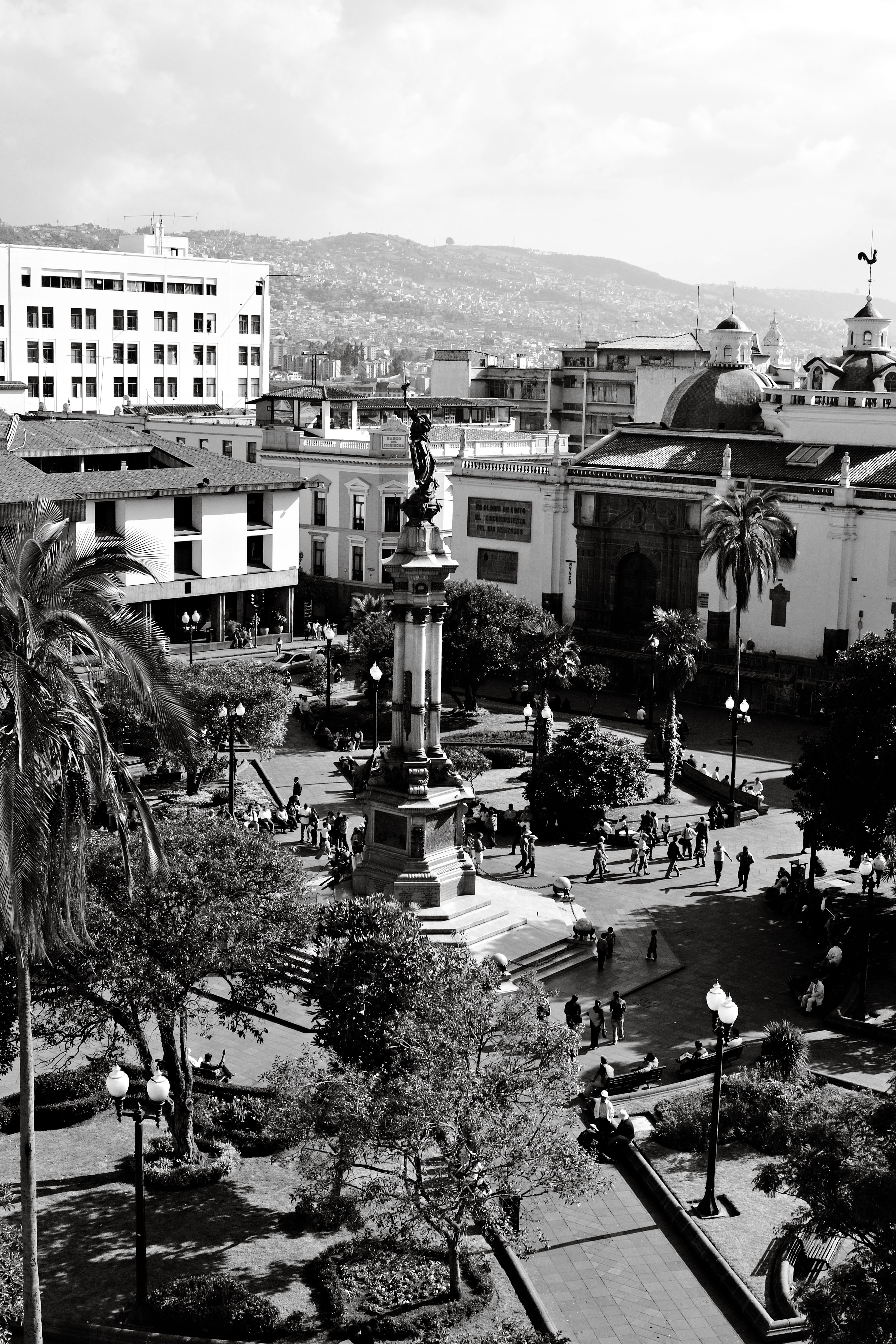 Black and white aerial shot of Independence Square in Quito, Ecuador, showcasing urban architecture and landmarks.