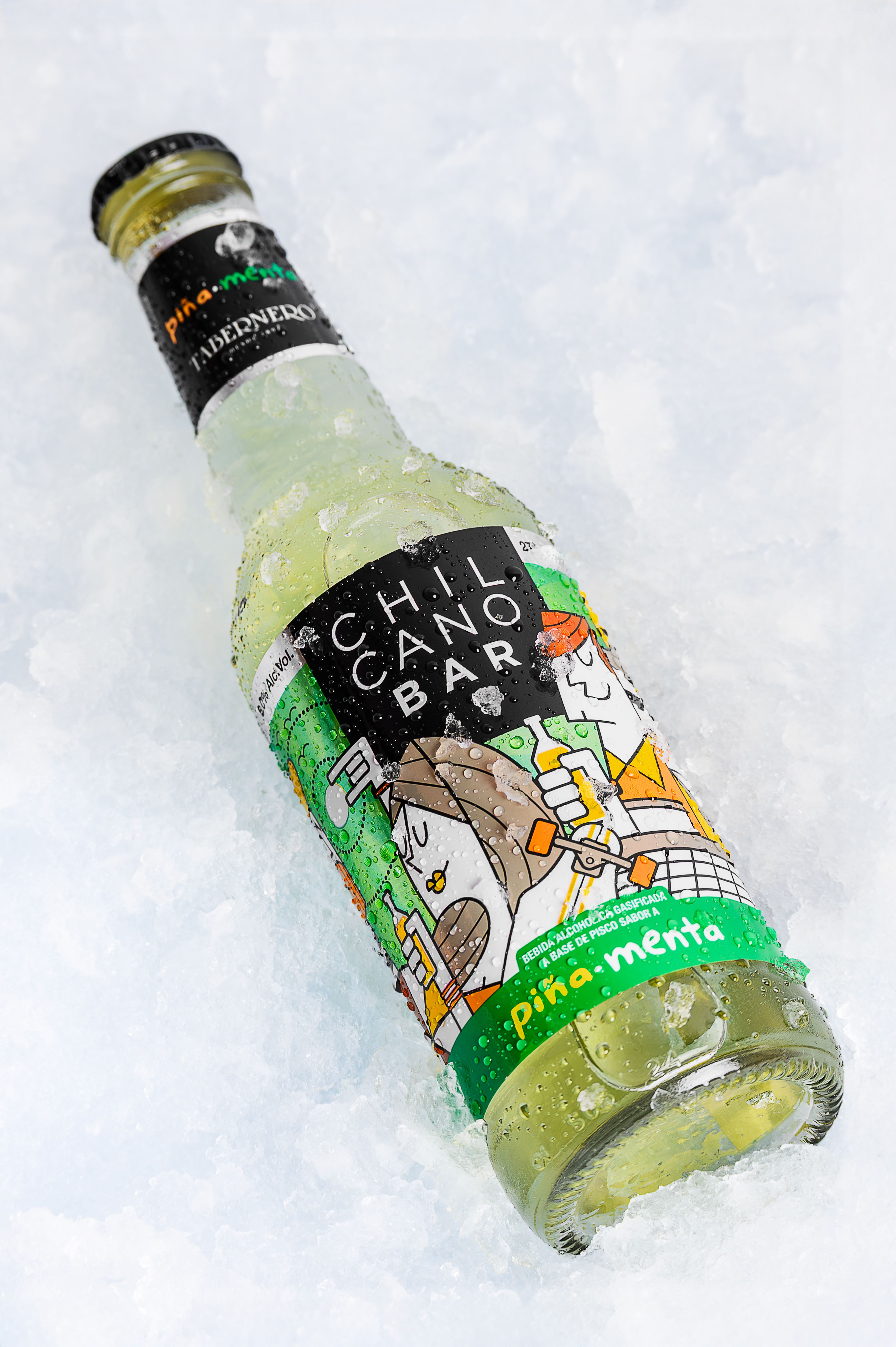 Refreshingly chilled Chilcano Bar Pina Menta bottle surrounded by ice, showcasing Peruvian drink culture.