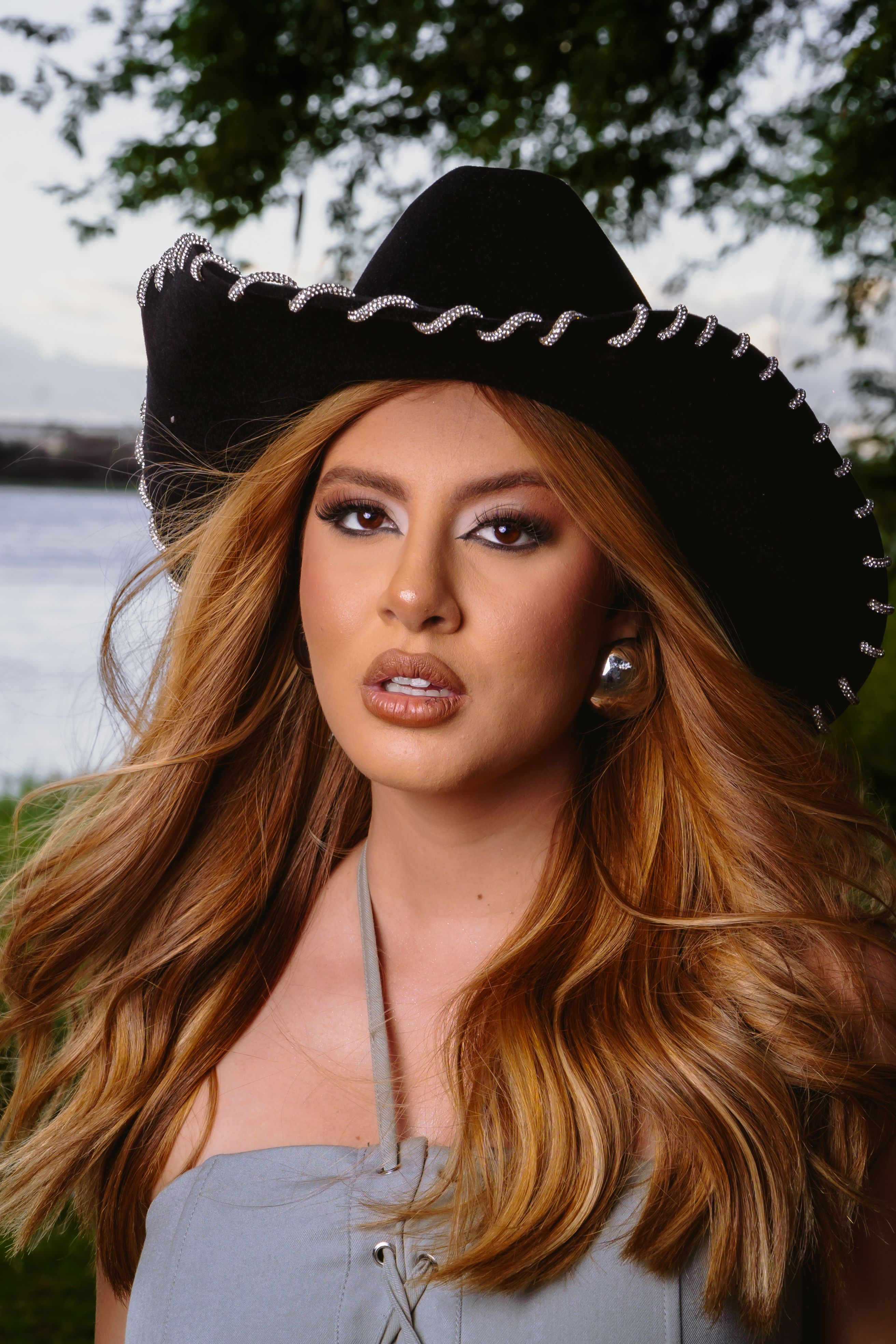 Stylish Woman in Black Cowboy Hat Outdoors · Free Stock Photo