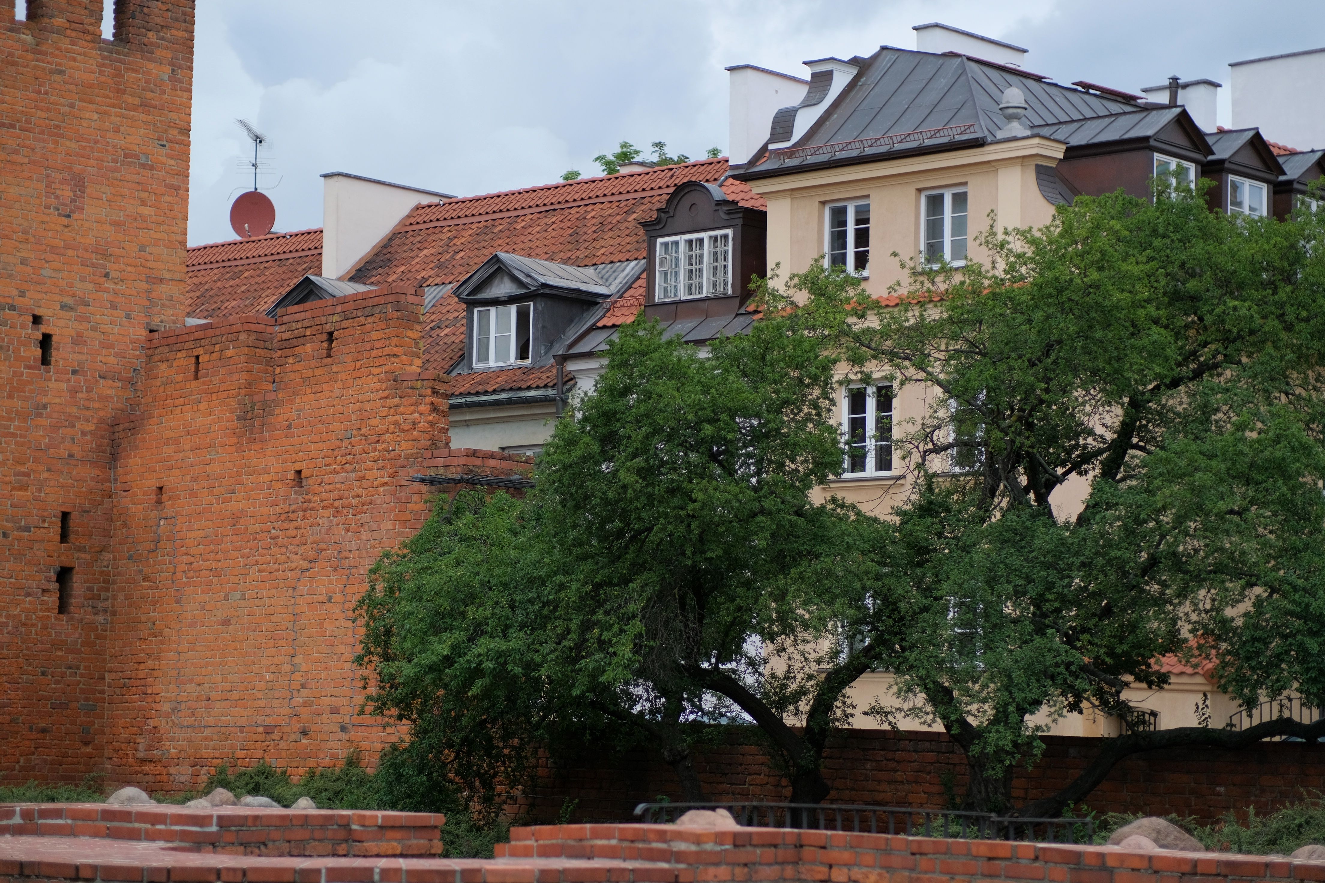 Capture of historic brick walls and residential buildings in a quaint neighborhood.