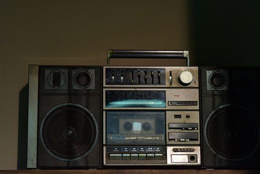 Retro Sanyo boombox with cassette player and speakers, evoking 80s nostalgia.