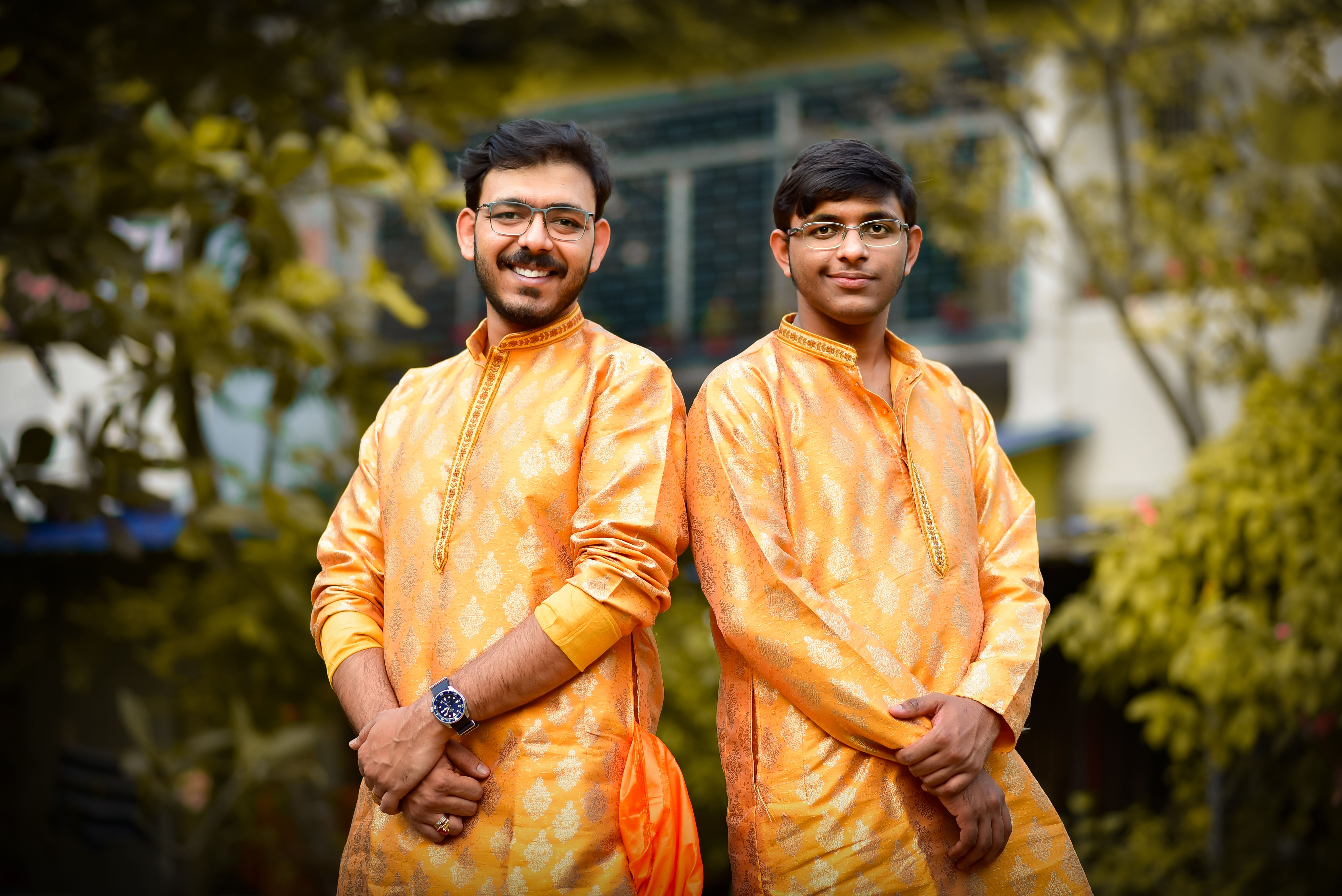 Two Men in Traditional Attire Posing Outdoors · Free Stock Photo