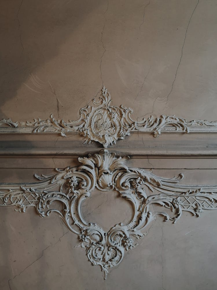 Ornamental Elements Placed On Shabby Wall