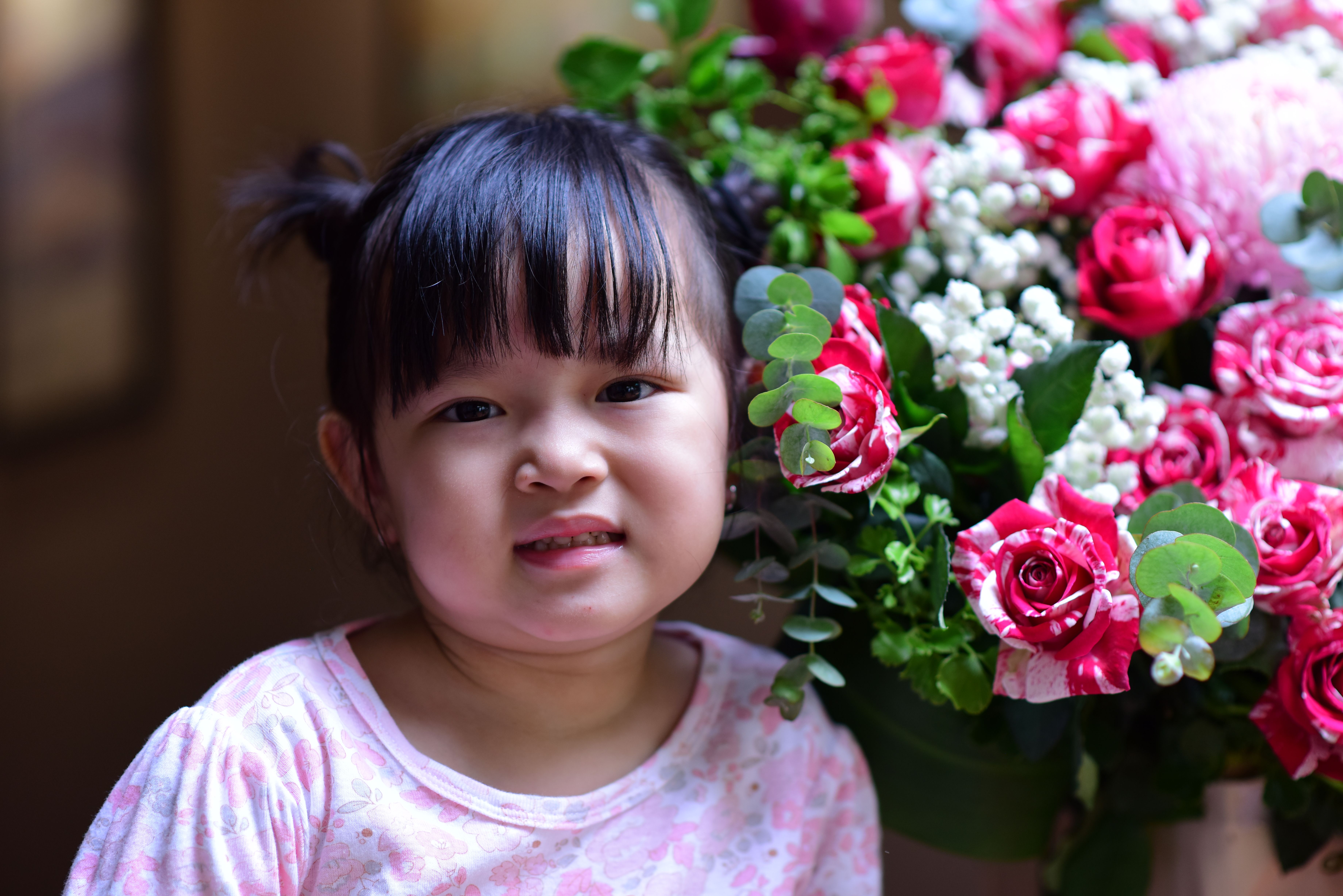 Portrait of Child with Colorful Floral Bouquet · Free Stock Photo