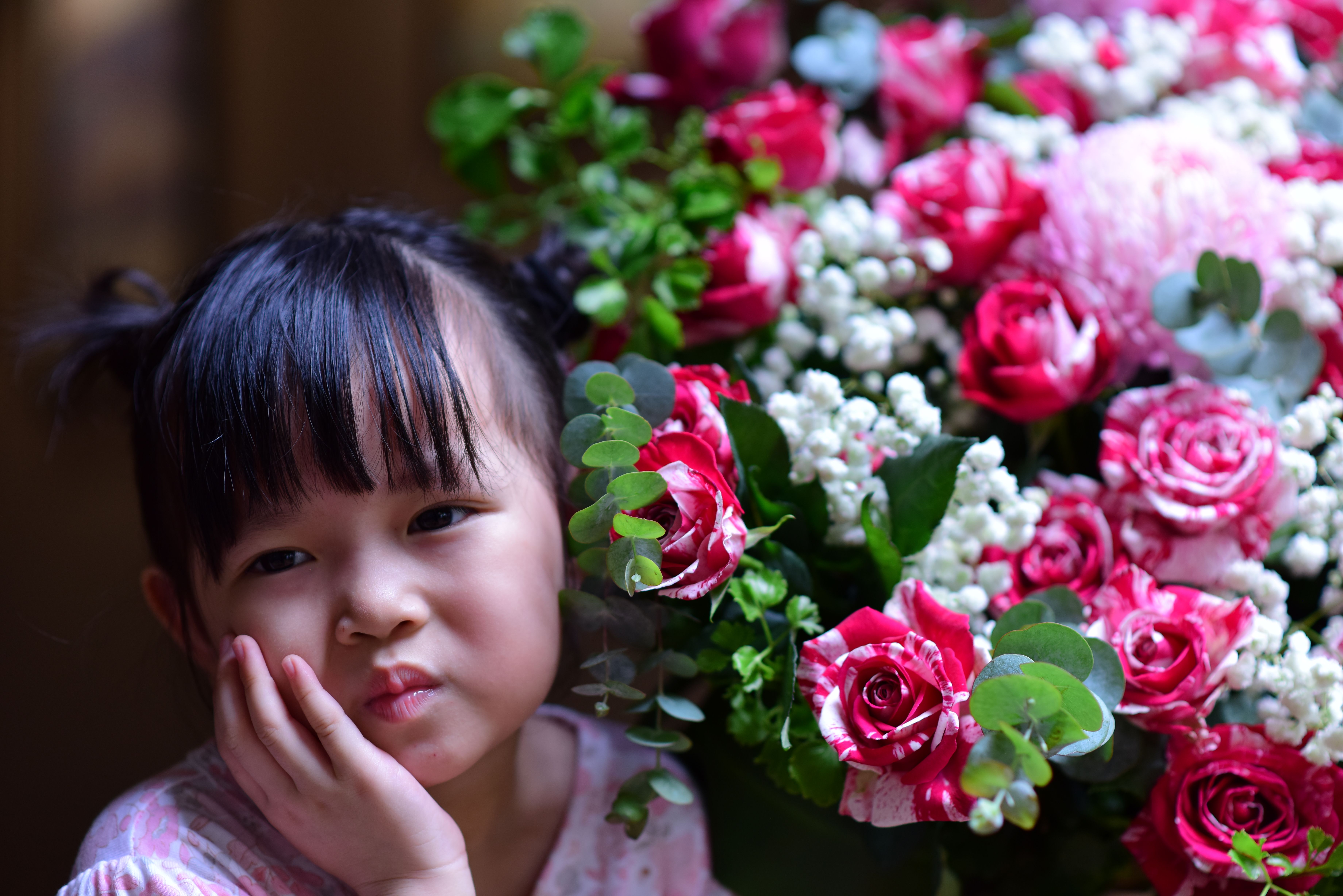 Young Girl with Roses and Baby's Breath Flowers · Free Stock Photo