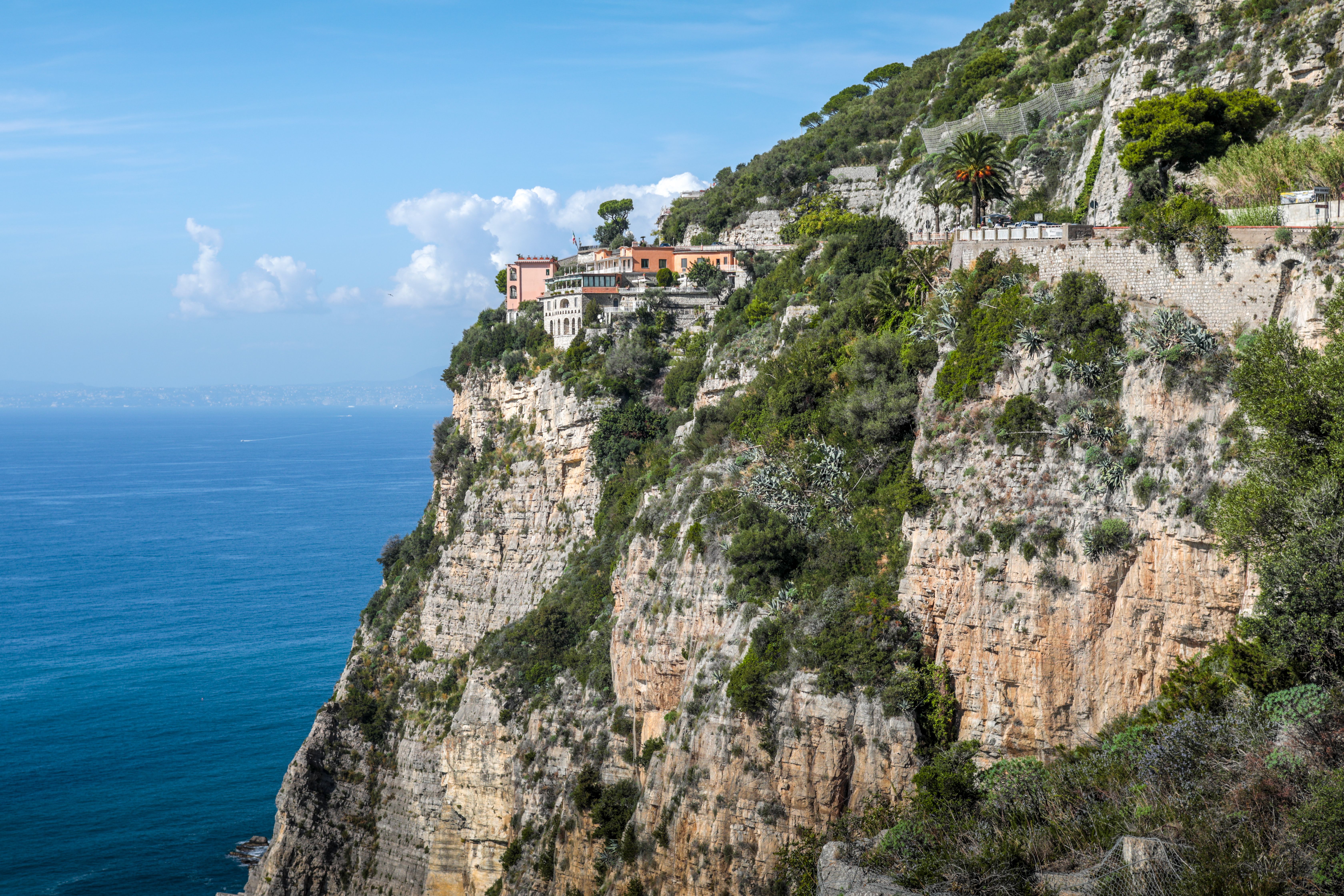 Breathtaking view of Amalfi Coast's cliffs with clear blue sea in Campania, Italy. (stock photo)