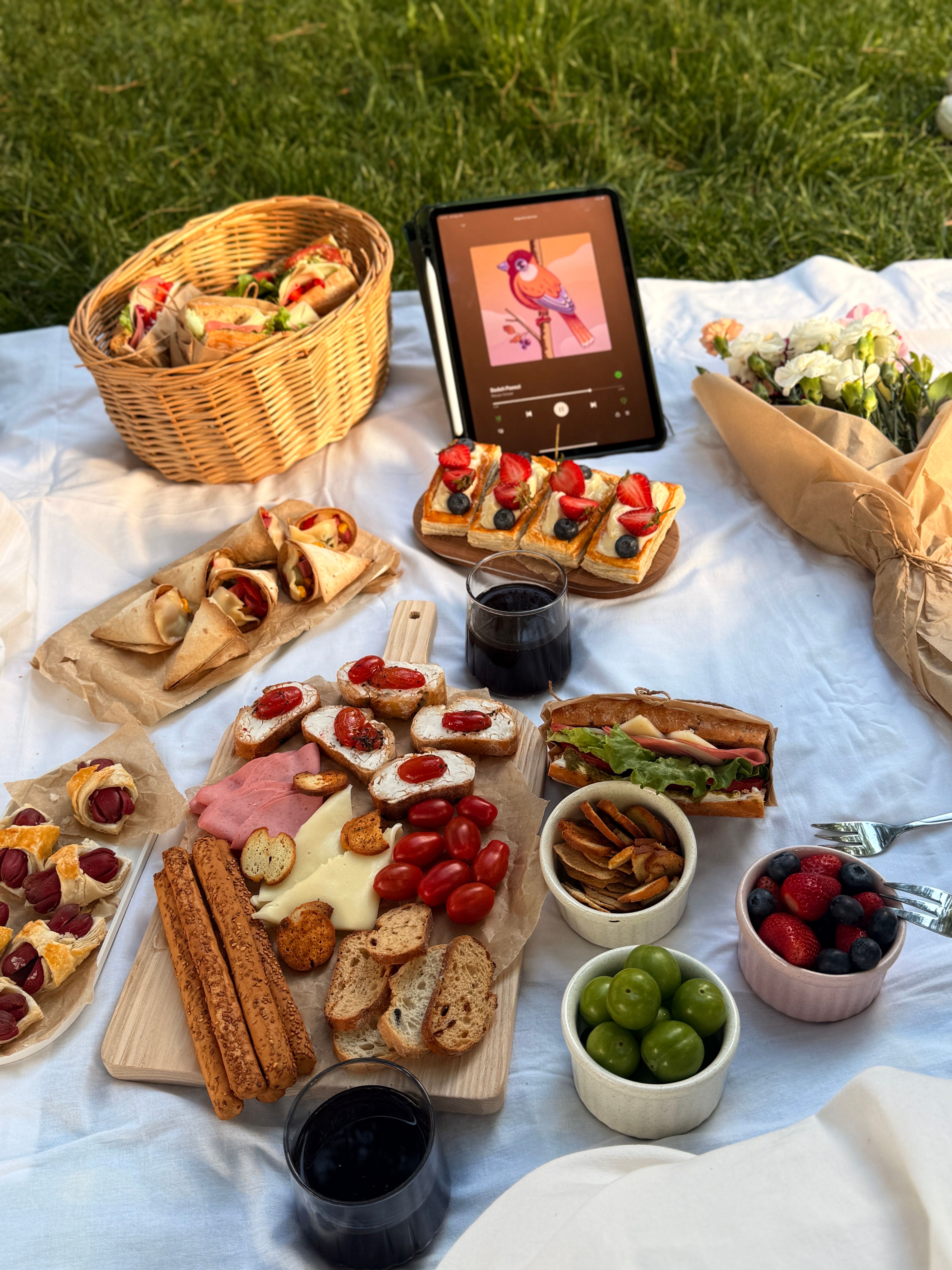 Outdoor Picnic with Gourmet Snacks and Tablet · Free Stock Photo