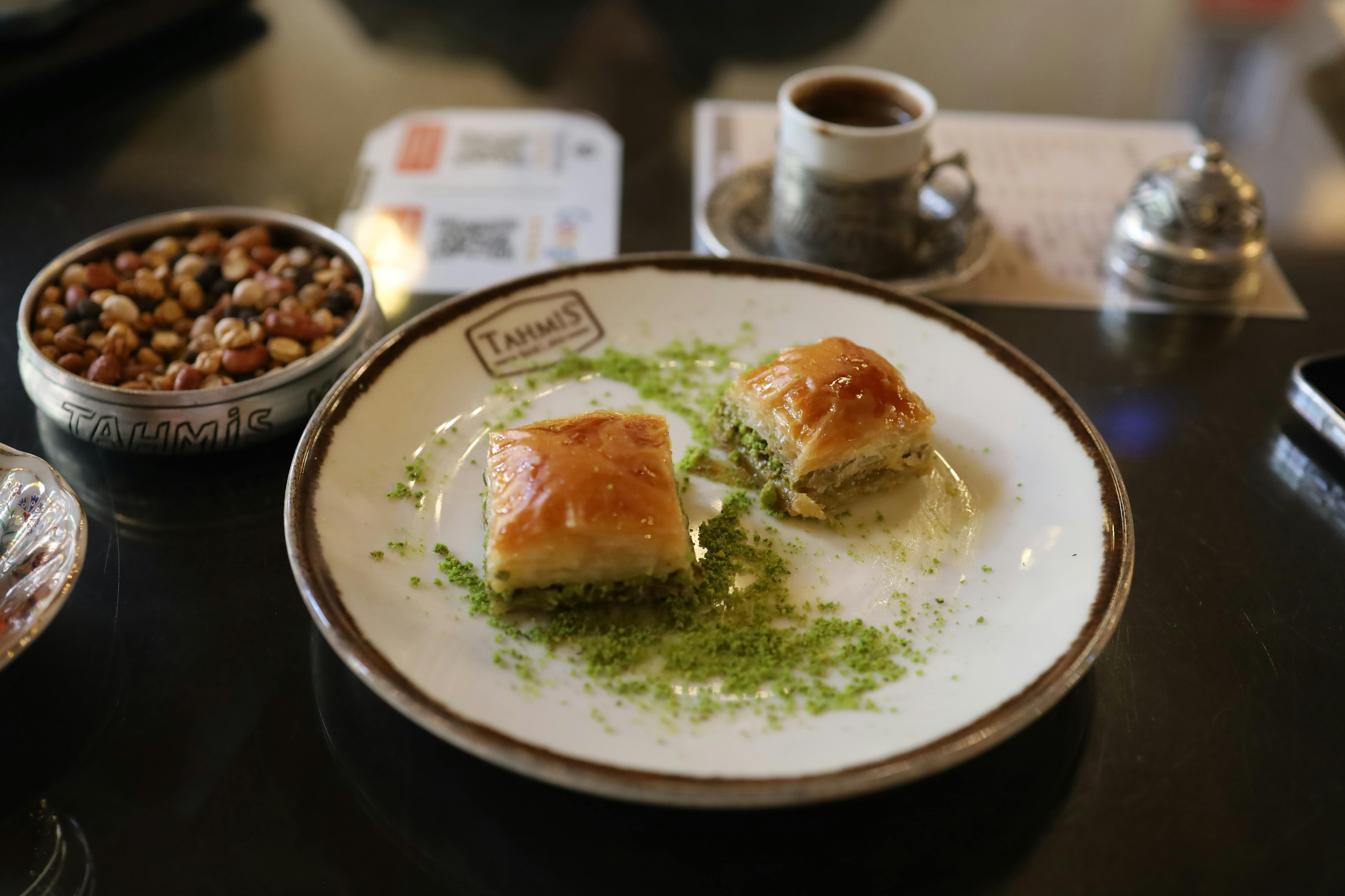 Free Close-up of traditional baklava served with Turkish coffee and nuts at a cafe in Gaziantep, Turkey. Stock Photo