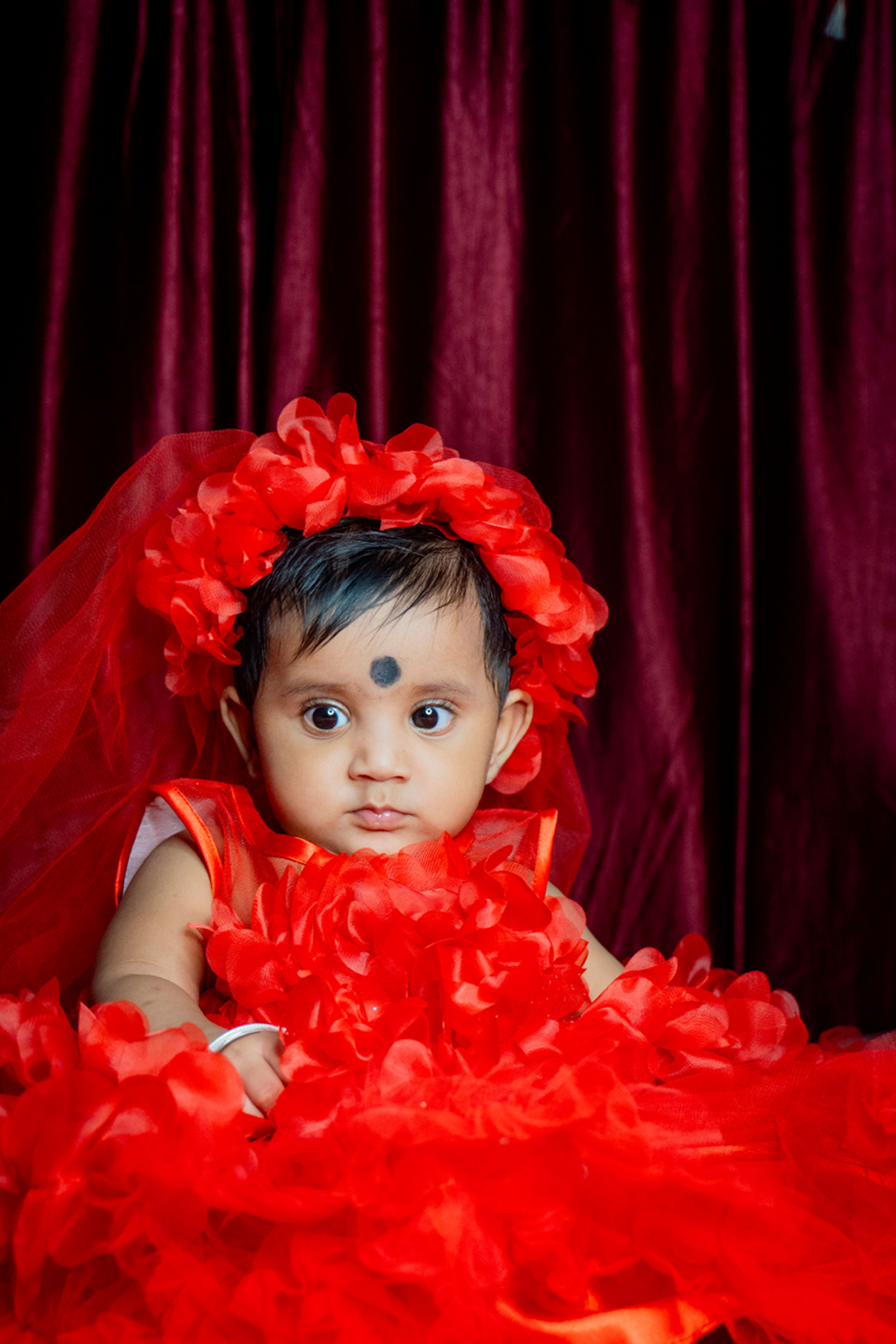 Adorable Baby in Vibrant Red Dress Portrait · Free Stock Photo