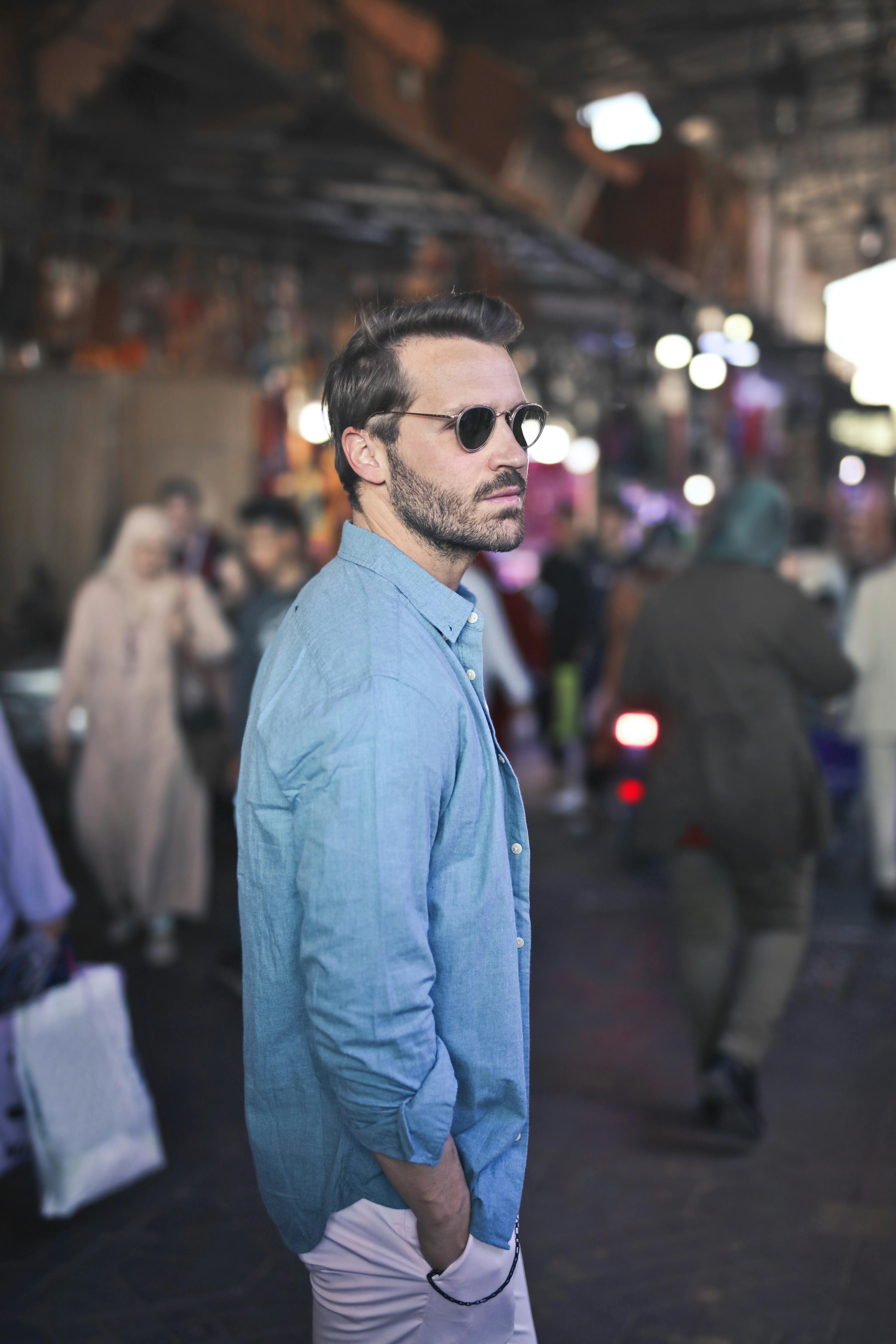 Man wearing blue long sleeves polo. | Photo: Pexels