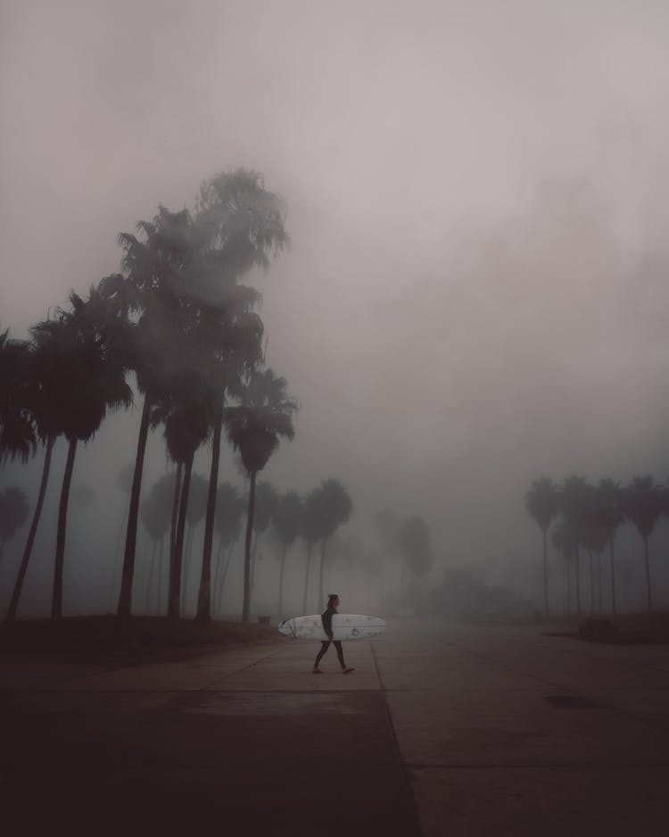 Surfer Walking On Road