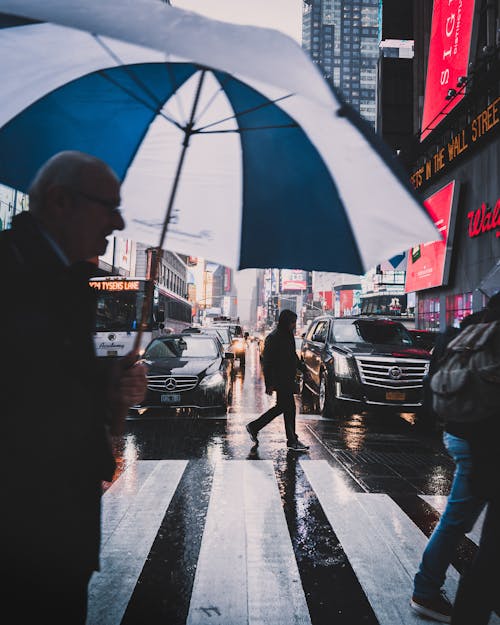 Photo Of Man Holding Umbrella
