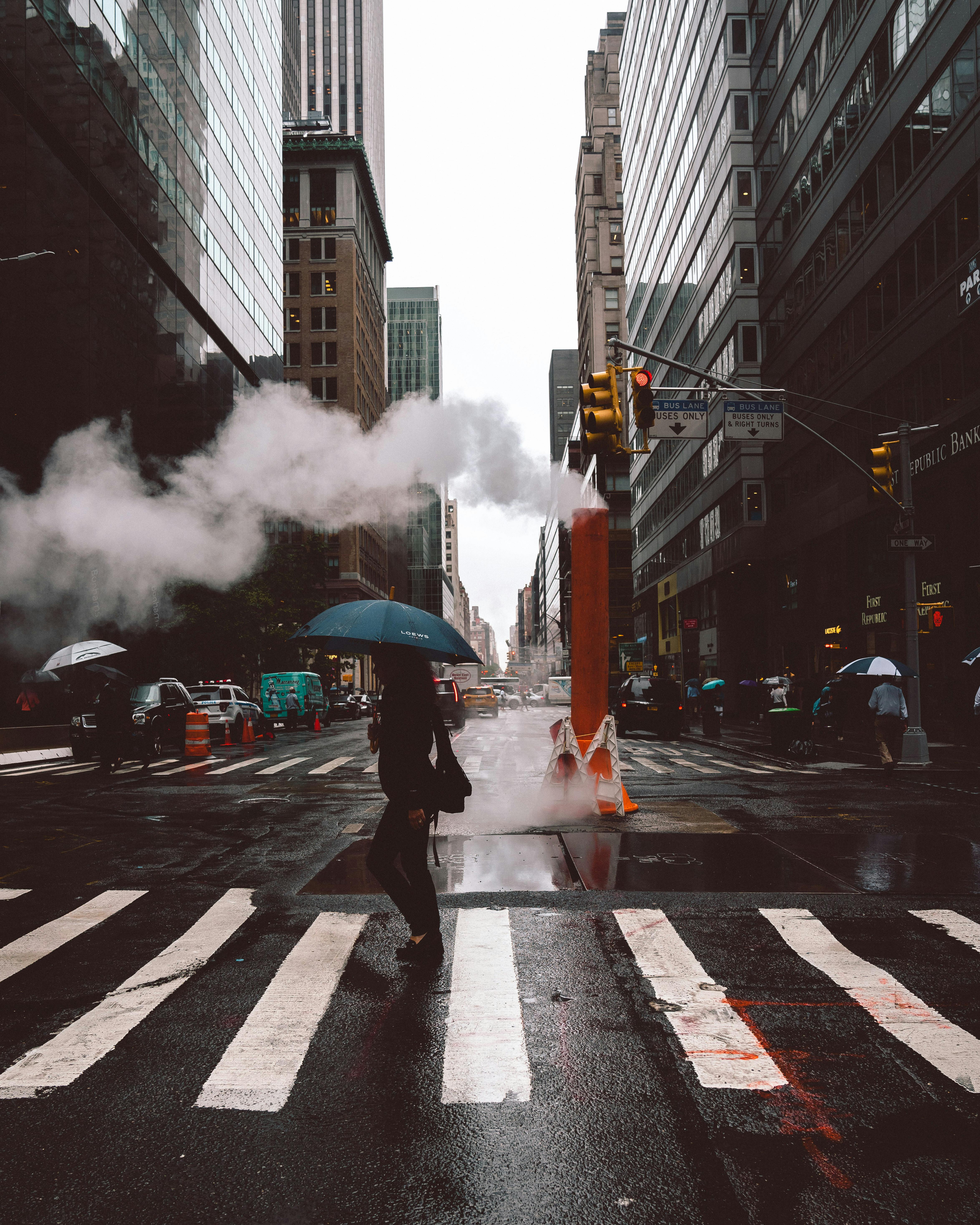 photo of person walking on pedestrian lane